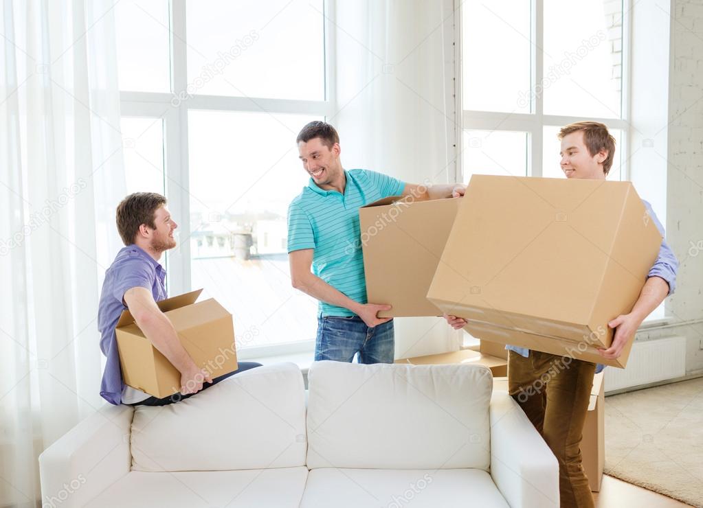 depositphotos_46602031-stock-photo-smiling-male-friends-carrying-boxes